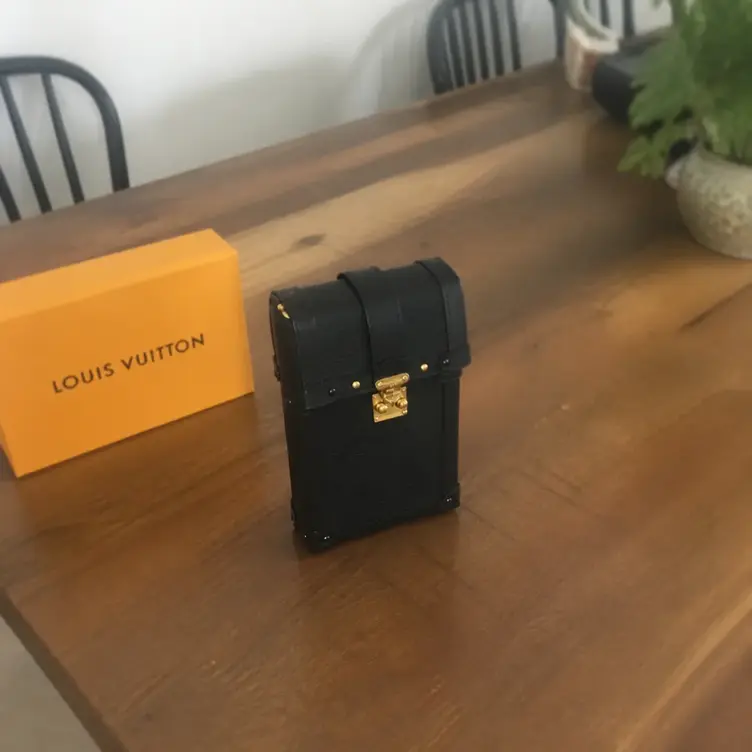 M67871 Epi Vertical Trunk Pochette M67871 photo review