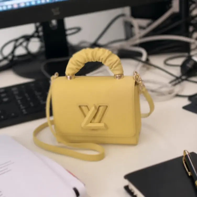 Taurillon Leather Twist PM-Yellow M58571 photo review