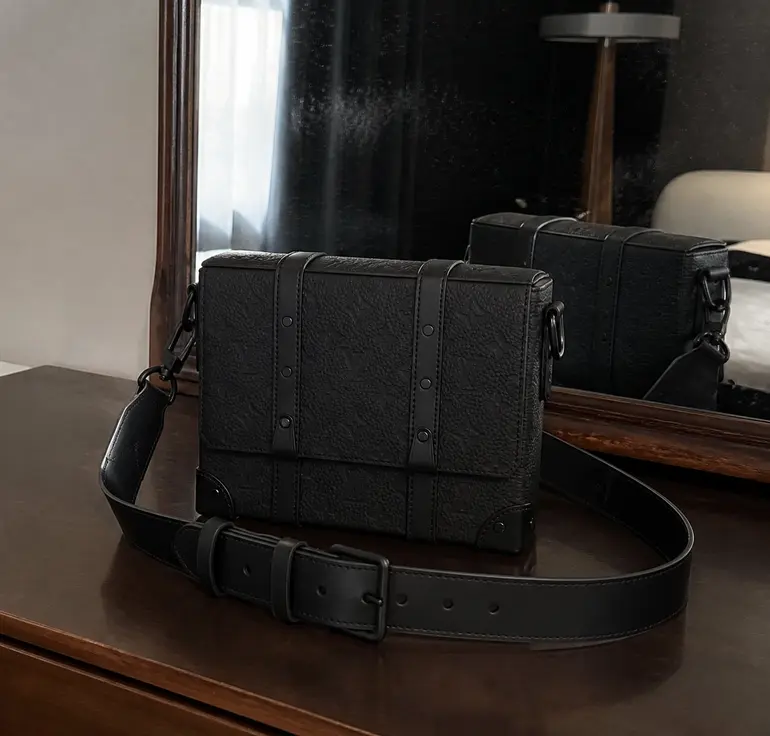 Monogram Embossed black-on-black Soft Trunk bag M55700 photo review